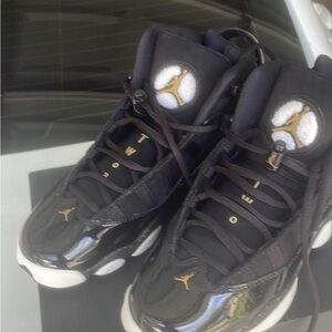 Jordan Black and Gold High-Top Sneakers